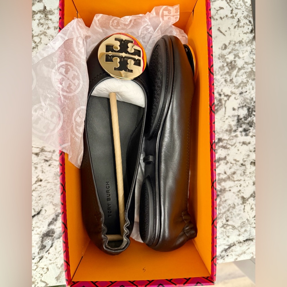 Brand new Tory Burch Black Leather flats with Gold metal Emblem